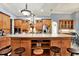 Spacious kitchen island with breakfast bar seating and granite countertops at 10030 Orchard Way, Spring Hill, FL 34608