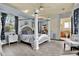 Comfortable main bedroom featuring a king size bed, wood-look flooring and a decorative ceiling fan at 10030 Orchard Way, Spring Hill, FL 34608