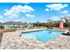 Gorgeous backyard featuring a pool with a patio, lush landscaping, and plenty of space for entertaining at 10030 Orchard Way, Spring Hill, FL 34608