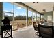 Spacious screened patio featuring tile flooring, ceiling fans, and backyard views at 10030 Orchard Way, Spring Hill, FL 34608