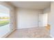 Cozy bedroom with soft carpeting, view to a pond, and ample natural light at 10118 Zennia Ln, Parrish, FL 34219