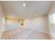 Large living area upstairs with plush carpeting, ample natural light, and open floor plan at 10118 Zennia Ln, Parrish, FL 34219