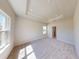 Cozy bedroom with plush carpeting, recessed lighting, and neutral color palette at 10123 Zennia Ln, Parrish, FL 34219