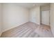 Carpeted bedroom with neutral walls, closet, and doorway leading to another room at 10127 Zennia Ln, Parrish, FL 34219