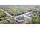 Aerial view of new construction home with lush forest in background at 12102 Chapman Ave, Port Charlotte, FL 33953