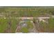 Expansive property featuring a fenced yard, above ground pool and surrounded by lush greenery at 13094 Tailorbird Ave, Brooksville, FL 34614