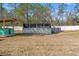 Spacious backyard features a covered patio and an above ground pool at 13094 Tailorbird Ave, Brooksville, FL 34614