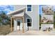 Charming two-story home with gray siding, and a welcoming front porch entry at 5173 Pacific Ave, Spring Hill, FL 34607