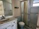 Bathroom featuring a shower and tub with a shower curtain, sink and toilet at 12501 Shadow Ridge Blvd, Hudson, FL 34669