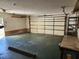 This is a garage featuring an automatic door, workbench, and ample room for parking and storage at 12501 Shadow Ridge Blvd, Hudson, FL 34669