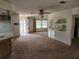 View of the open floor plan with access to the kitchen, dining area, and entryway at 12501 Shadow Ridge Blvd, Hudson, FL 34669