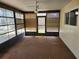 The sun room features a ceiling fan, multiple windows for natural light, and interior blinds at 12501 Shadow Ridge Blvd, Hudson, FL 34669