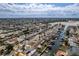 Aerial view shows a tranquil waterfront neighborhood with direct access to a wide channel and the open sea at 13705 Allyn Dr, Hudson, FL 34667