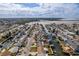 Wide aerial view showcases canals of waterfront community with houses each having a unique design and character at 13705 Allyn Dr, Hudson, FL 34667