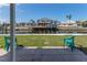 Waterfront backyard with dock, boat lift, and seating area, perfect for enjoying the water view at 13705 Allyn Dr, Hudson, FL 34667