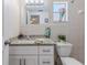 Updated bathroom with granite countertops and bright lighting at 13705 Allyn Dr, Hudson, FL 34667
