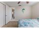 Charming bedroom with wood floors, a ceiling fan, and neutral walls, creating a relaxing atmosphere at 13705 Allyn Dr, Hudson, FL 34667