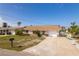 Attractive single-story home with a well-manicured lawn, attached garage, and inviting curb appeal at 13705 Allyn Dr, Hudson, FL 34667