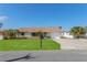 Charming single-story home with well-maintained lawn and attached garage in a residential neighborhood at 13705 Allyn Dr, Hudson, FL 34667