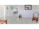 Hallway area featuring tile floors that connects various rooms, providing ample space for decor at 13705 Allyn Dr, Hudson, FL 34667