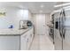 Bright kitchen with modern appliances, granite countertops, and ample cabinet space at 13705 Allyn Dr, Hudson, FL 34667