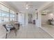 Inviting living room with neutral decor, tile floors and views to other spaces at 13705 Allyn Dr, Hudson, FL 34667