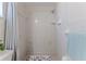 Tiled walk-in shower with a removable shower head at 13705 Allyn Dr, Hudson, FL 34667