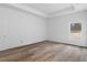 Bright bedroom with trey ceilings, wood floors and a window at 16434 Medley Rd, Weeki Wachee, FL 34614