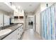 Bathroom featuring double sinks, granite countertops, and a walk-in closet at 194 Argyll Dr, Spring Hill, FL 34609