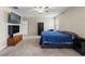 Bright bedroom with a ceiling fan, TV, and carpeted floor, offering a relaxing space at 194 Argyll Dr, Spring Hill, FL 34609