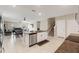 Open kitchen featuring an island and views to the living space at 194 Argyll Dr, Spring Hill, FL 34609