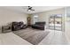 Comfortable living room featuring leather furniture and a modern rug on tile flooring at 194 Argyll Dr, Spring Hill, FL 34609