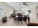 Open living room with tile floors, a ceiling fan, and neutral color palette at 194 Argyll Dr, Spring Hill, FL 34609