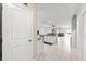 Bright, open-concept living space featuring a kitchen island and modern tile flooring throughout at 194 Argyll Dr, Spring Hill, FL 34609