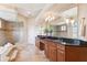 Relax in the luxurious bathroom featuring a jetted tub, walk-in shower, and double vanity at 20200 Lace Cascade Rd, Land O Lakes, FL 34637