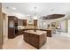 Spacious kitchen features stainless steel appliances, custom cabinetry, and an island with seating at 20200 Lace Cascade Rd, Land O Lakes, FL 34637