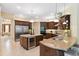 Gourmet kitchen features granite countertops, stainless steel appliances, and a wine refrigerator at 20200 Lace Cascade Rd, Land O Lakes, FL 34637