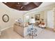 Bright living room features a decorative ceiling, neutral paint, tile floors, and lots of natural light at 20200 Lace Cascade Rd, Land O Lakes, FL 34637