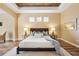 This lovely bedroom features a decorative ceiling, wood floors, a soft rug, and is well-appointed at 20200 Lace Cascade Rd, Land O Lakes, FL 34637