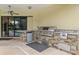 Outdoor kitchen boasts a built-in grill and stone accents, perfect for alfresco dining and entertaining at 20200 Lace Cascade Rd, Land O Lakes, FL 34637