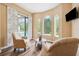 Comfortable sitting room overlooking the screened pool and deck at 20200 Lace Cascade Rd, Land O Lakes, FL 34637