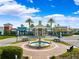 Charming town center with a decorative fountain, retail stores, and attractive landscaping at 20200 Lace Cascade Rd, Land O Lakes, FL 34637