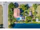Aerial view of the property with a pool, lush landscaping, gazebo, and waterfront access at 3308 Oleander Dr, Hernando Beach, FL 34607