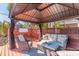 Outdoor gazebo featuring comfortable seating, creating a cozy relaxation area at 3308 Oleander Dr, Hernando Beach, FL 34607