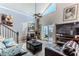 Comfortable living room with high ceilings, a ceiling fan, and sliding glass doors that lead to an outdoor deck at 3308 Oleander Dr, Hernando Beach, FL 34607