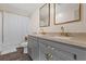 Bathroom showcasing double sinks, decorative mirrors, granite countertops and modern fixtures at 3323 Parlow Ave, Spring Hill, FL 34606