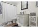 Elegant bathroom featuring a white vanity, modern fixtures, and decorative elements for a refined and updated feel at 3323 Parlow Ave, Spring Hill, FL 34606