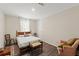 Bedroom featuring a comfy bed, a chair, and plenty of natural light at 3323 Parlow Ave, Spring Hill, FL 34606