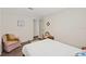 Bedroom featuring a comfy bed, a chair, and plenty of natural light at 3323 Parlow Ave, Spring Hill, FL 34606
