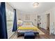 Bright bedroom with a window, wood-look floors, and doorway to other rooms at 3323 Parlow Ave, Spring Hill, FL 34606